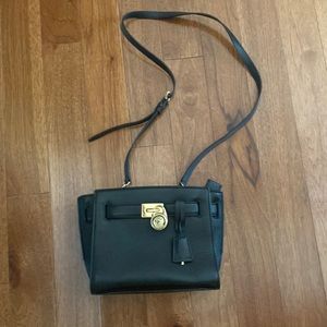 Michael Kors Black leather bag . Good condition. 7” tall- 8.5 inches wide.
